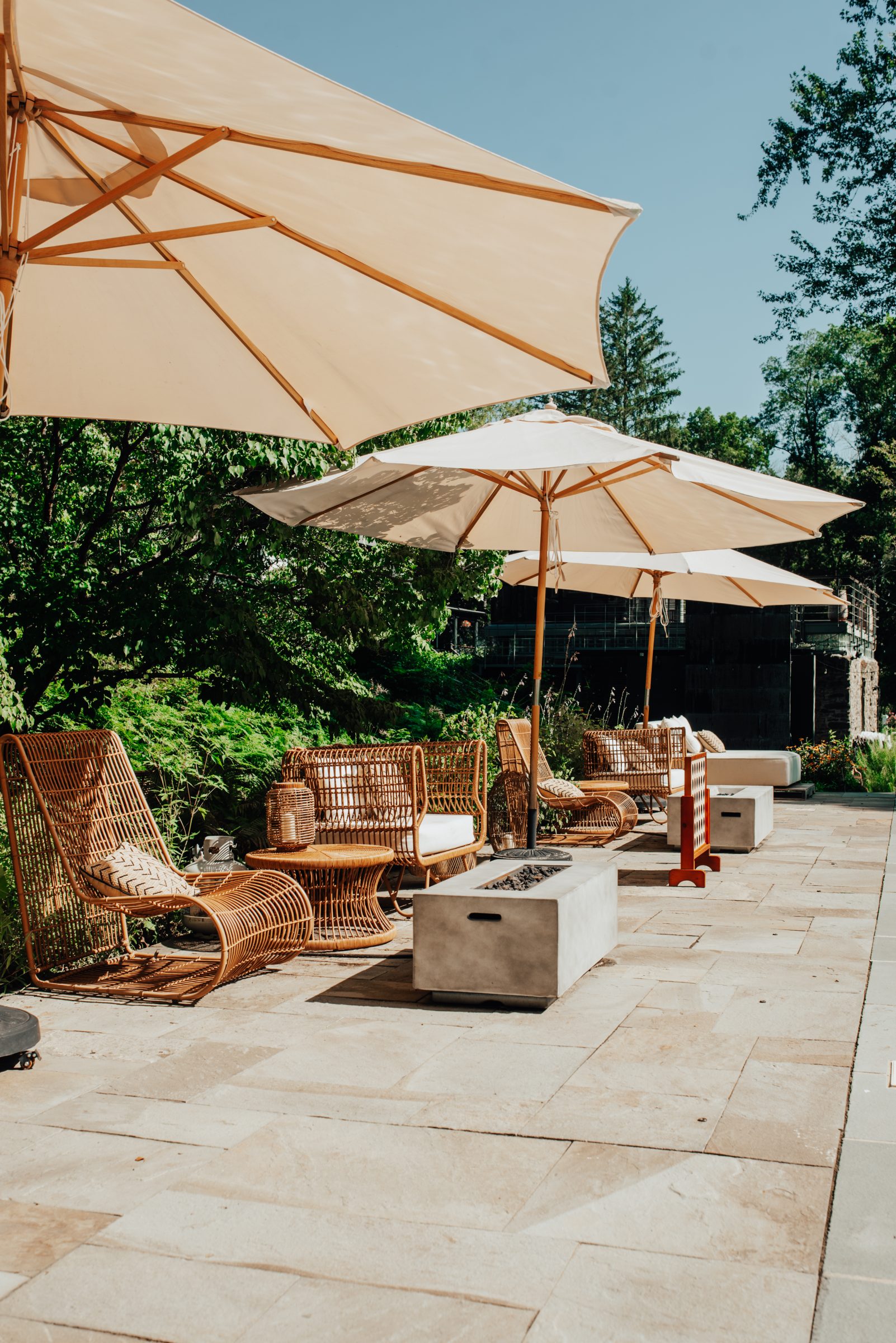 Rattan lounge seating and umbrellas on the pool deck